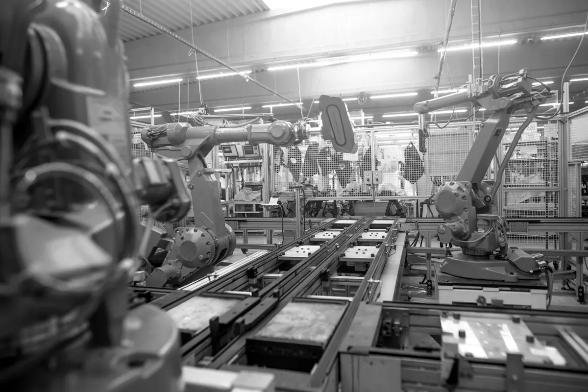Robotic arms on an automated factory assembly line